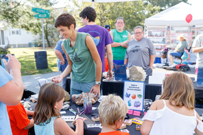 Appalachian Geological & Environmental Sciences student at geology "make and take" crafts table